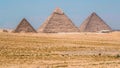 This picture taken on July 1, 2020 shows a general view of (R to L) the Great Great Pyramid of Khufu (Cheops), the Pyramid of Khafre (Chephren), and the Pyramid of Menkaure (Menkheres) at the Giza Pyramids necropolis on the southwestern outskirts of the Egyptian capital Cairo.