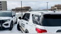 Two Salt Lake County Sheriff's vehicles. A Utah man is accused of killing his co-worker at a storage facility.