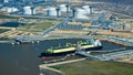 The Asia Vision LNG carrier ship sits docked at the Cheniere Energy Inc. terminal in this aerial photograph taken over Sabine Pass, Texas, U.S., on Wednesday, Feb. 24, 2016. Cheniere said in a statement last month. Cheniere Energy Inc. expects to ship the first cargo of liquefied natural gas on Wednesday to Brazil with another tanker to be loaded a few days later, marking the historic start of U.S. shale exports and sending its shares up the most in more than a month. Photographer: Lindsey Janies/Bloomberg via Getty Images
