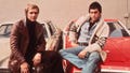 Promotional portrait of American actors David Soul and Paul Michael Glaser sitting on the hoods of their cars, from the television series, 'Starsky and Hutch,' circa 1977. (Photo by Frank Edwards/Fotos International/Getty Images)