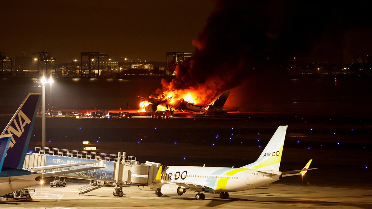 The airport runway, plane, flames