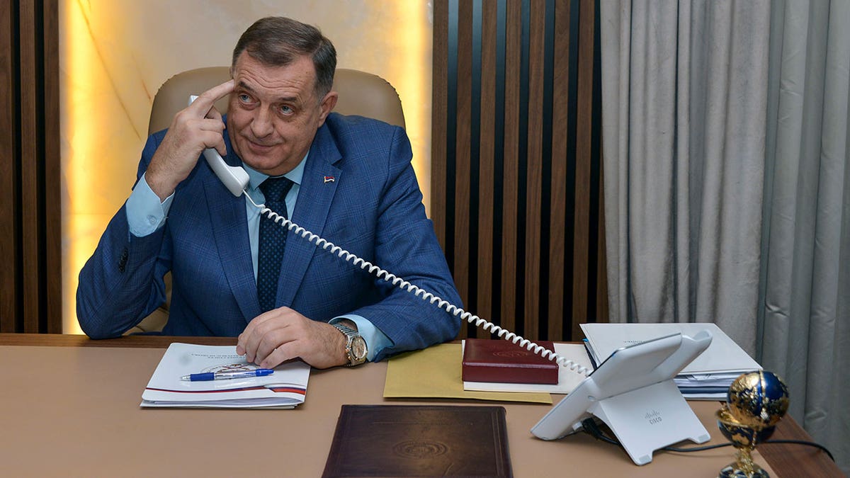 Milorad Dodik uses his phone