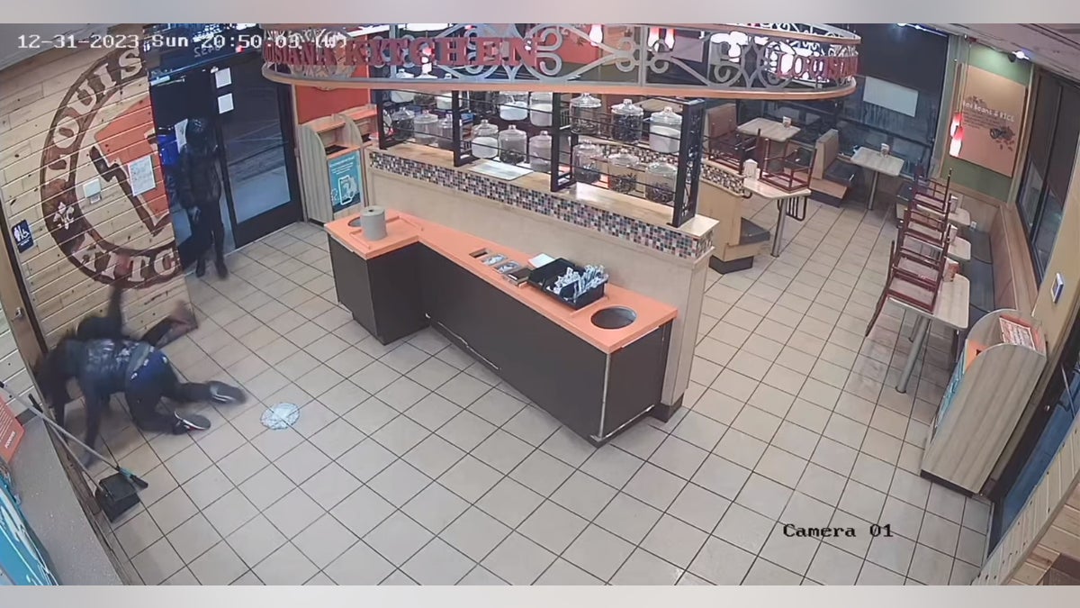 Robbery suspects falling on surveillance video