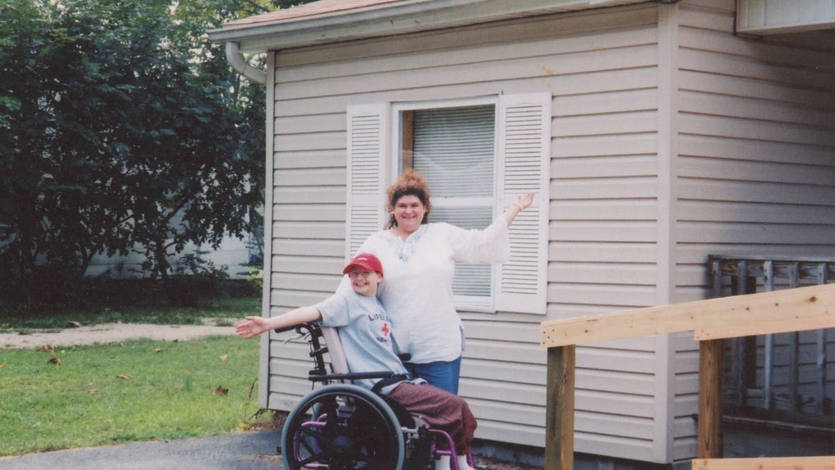 Gypsy and Dee Dee Blanchard pose in front of their Habitat for Humanity home