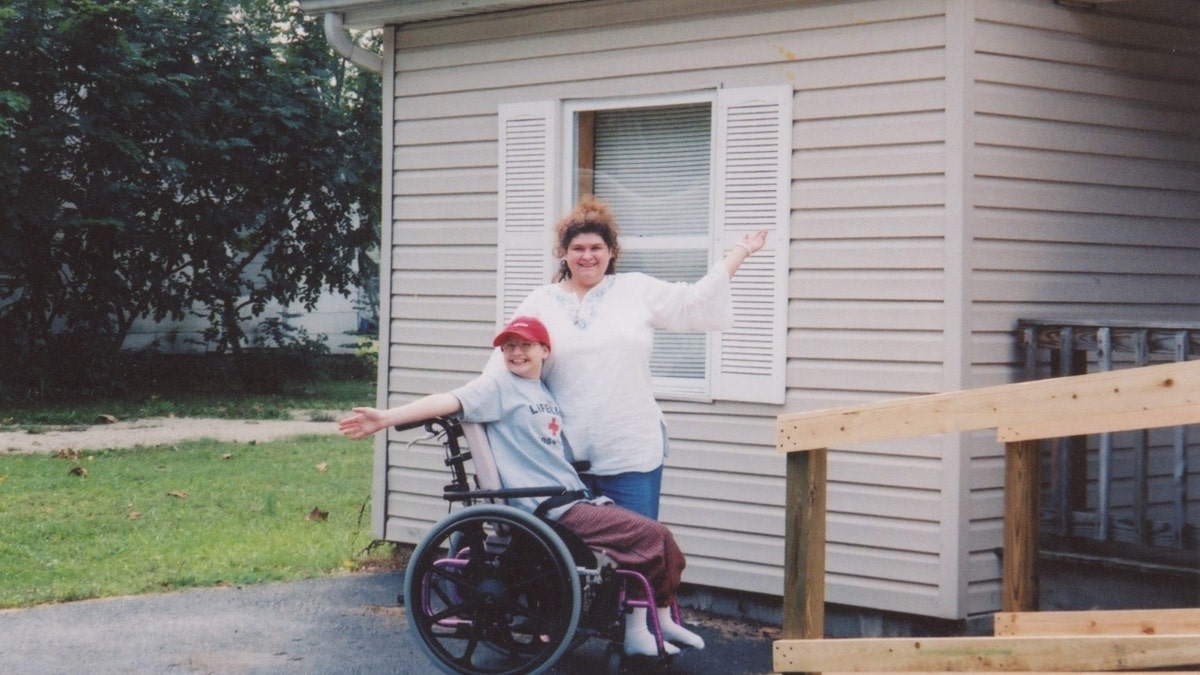 Gypsy Rose Blanchard in a wheelchair posing with her mother, Dee Dee Blanchard