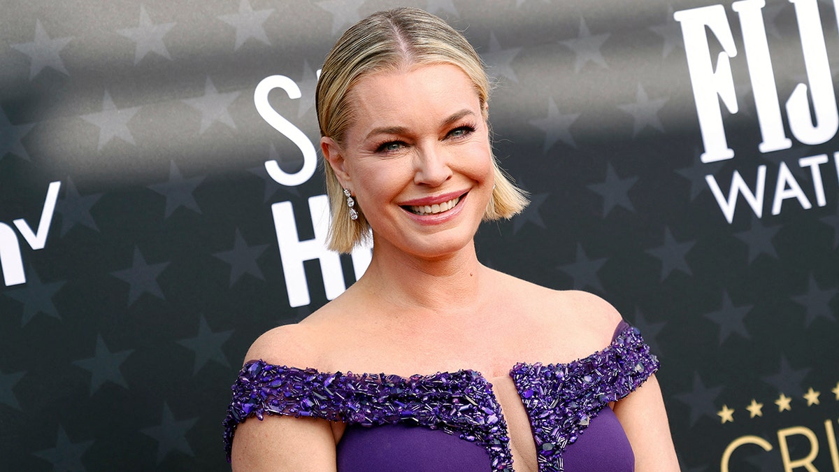 Rebecca Romijn in a sleveless purple sparkly gown at the Critics' Choice Awards