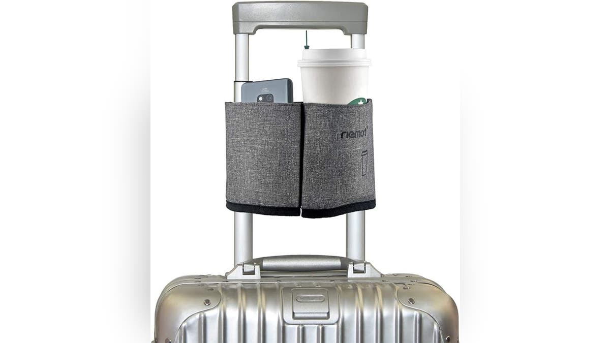 Add extra space to your luggage with this attachable trinket holder. 