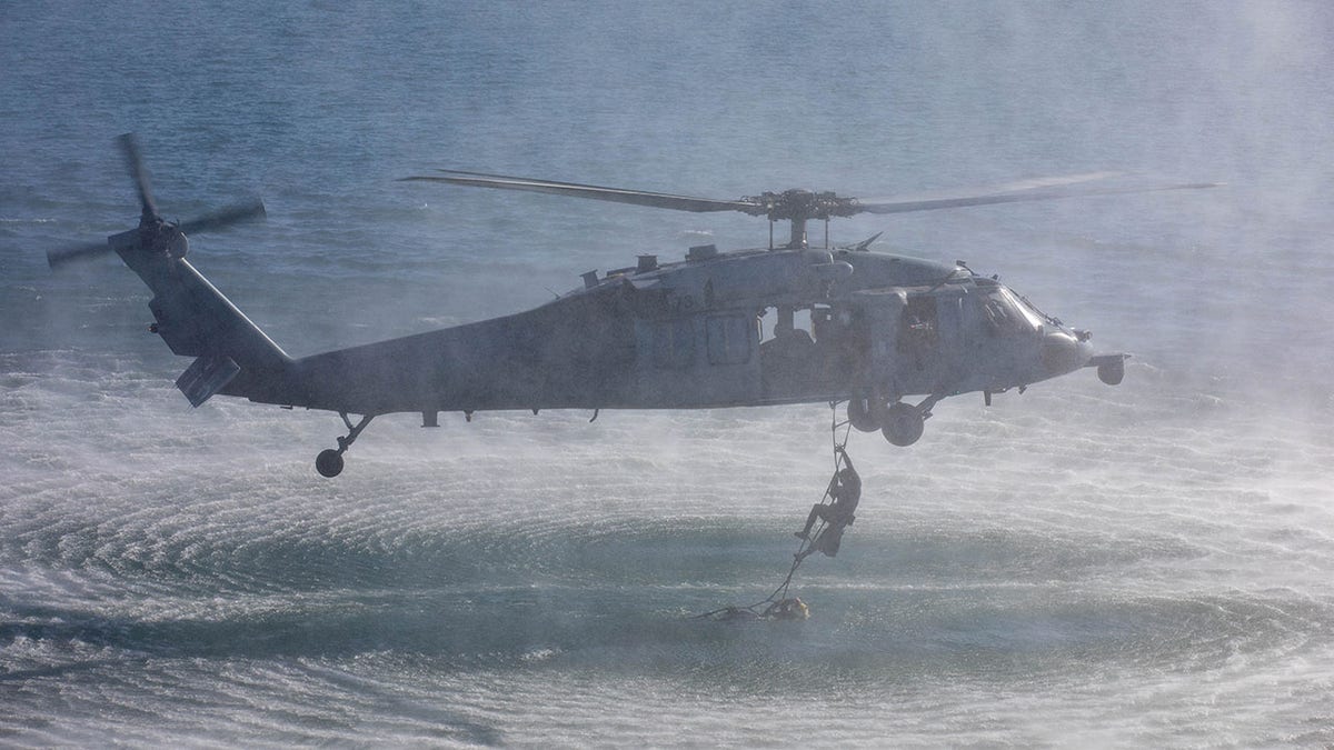 Helicopter above water