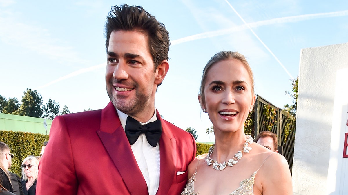 John Krasinski on the red carpet with Emily Blunt