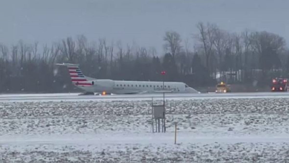 American Airlines plane slides of taxiway at New York airport amid snowy weather