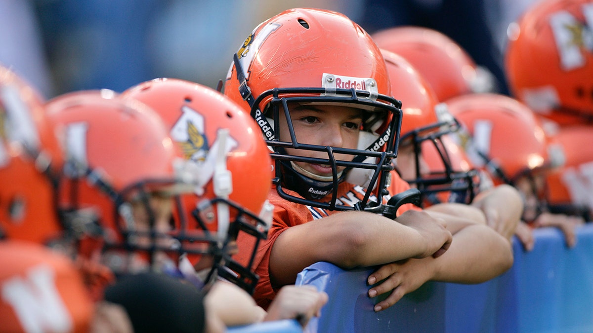 Children with orange helmets.