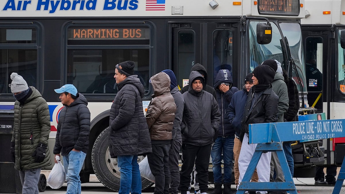 Chicago migrants outside warming bus