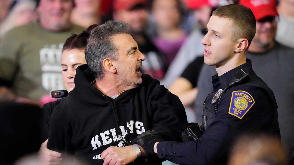 New Hampshire protester removed from Trump rally after rushing stage