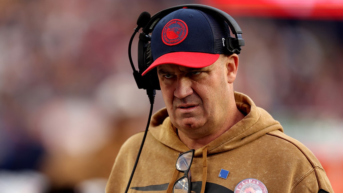 Bill O'Brien looks on field