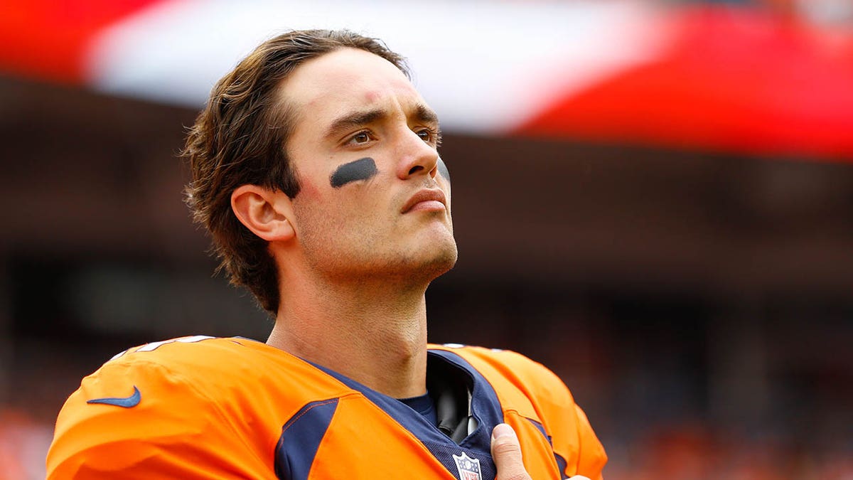 Brock Osweiler looks on before a game