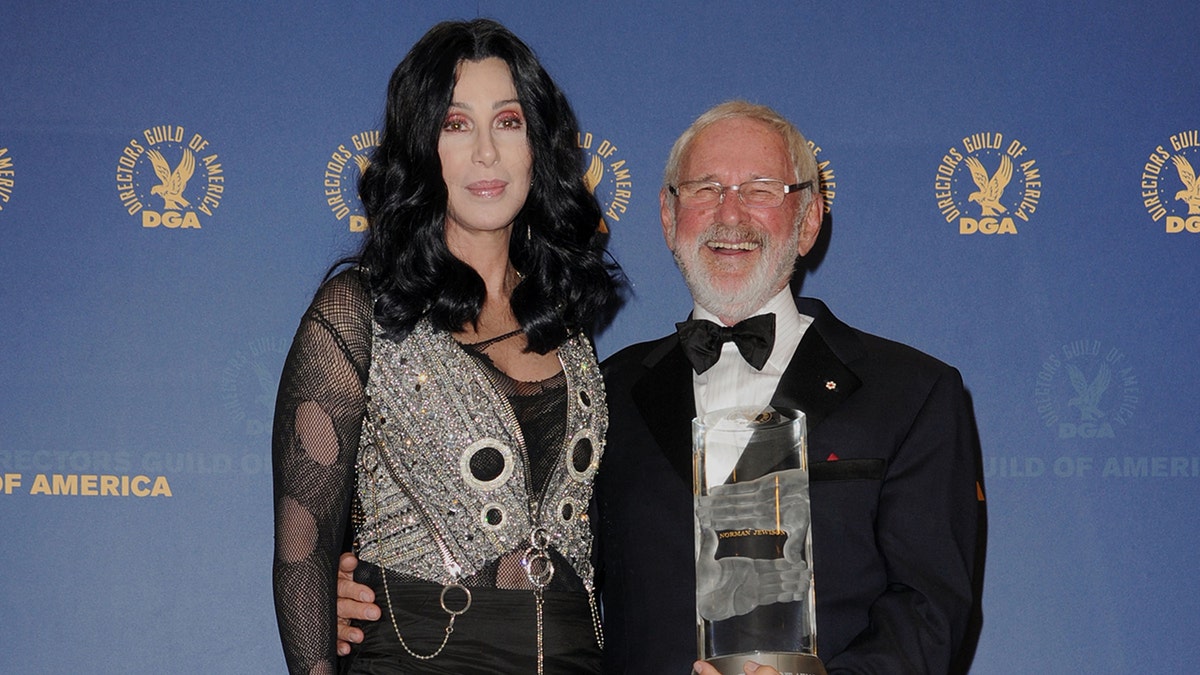 Norman Jewison and Cher posing together