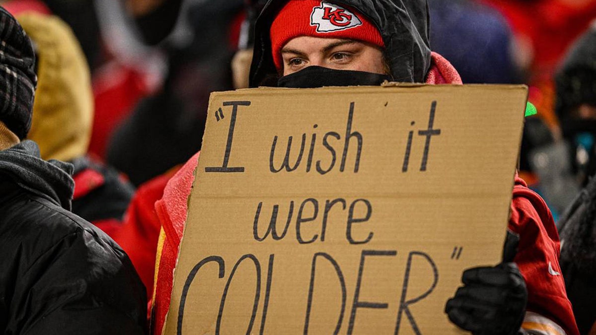Chiefs fan holds sign that says "I wish it were COLDER."