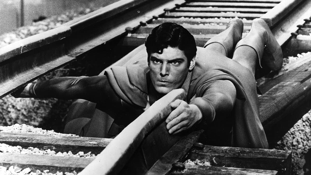 Black and white photo of Christopher Reeve as Superman