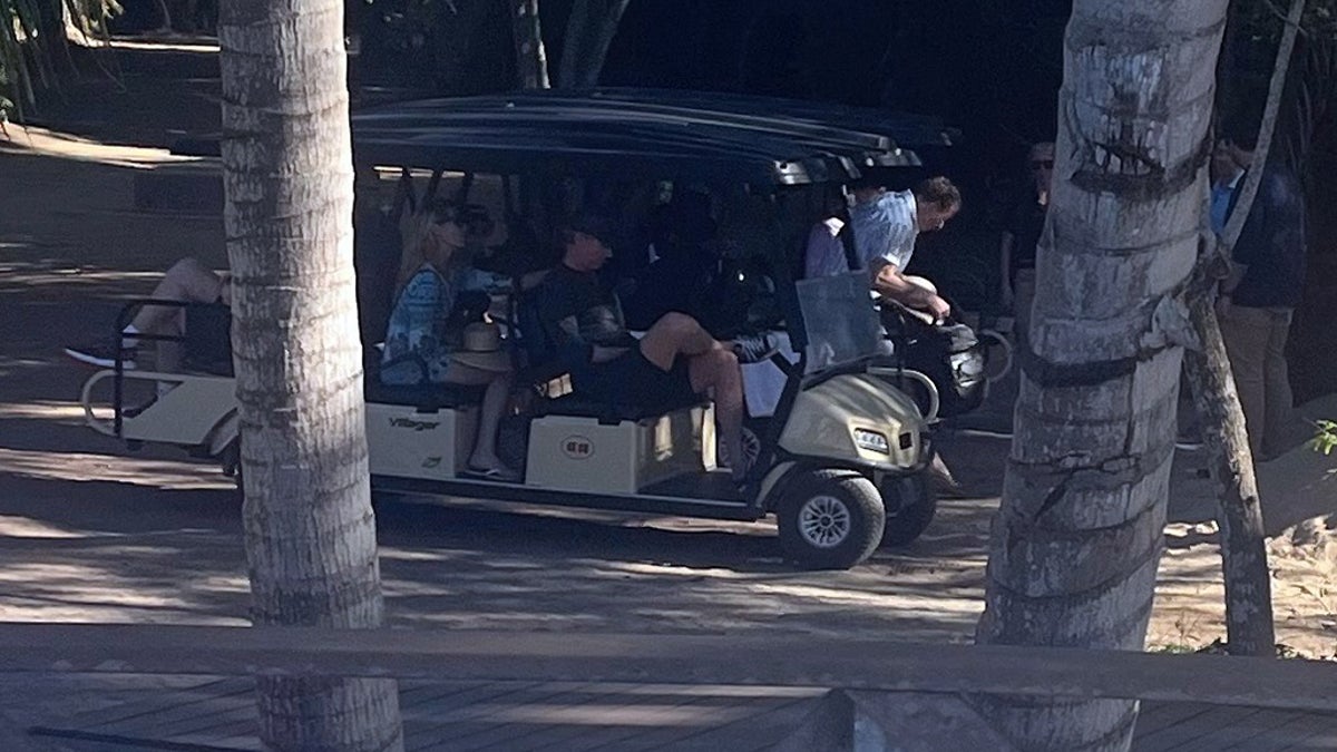 California Gov. Newsom sitting in a golf cart