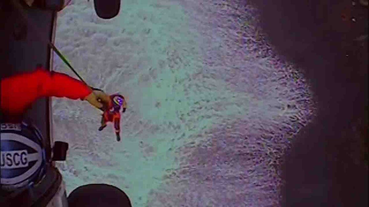 rescue swimmer lowered to beach