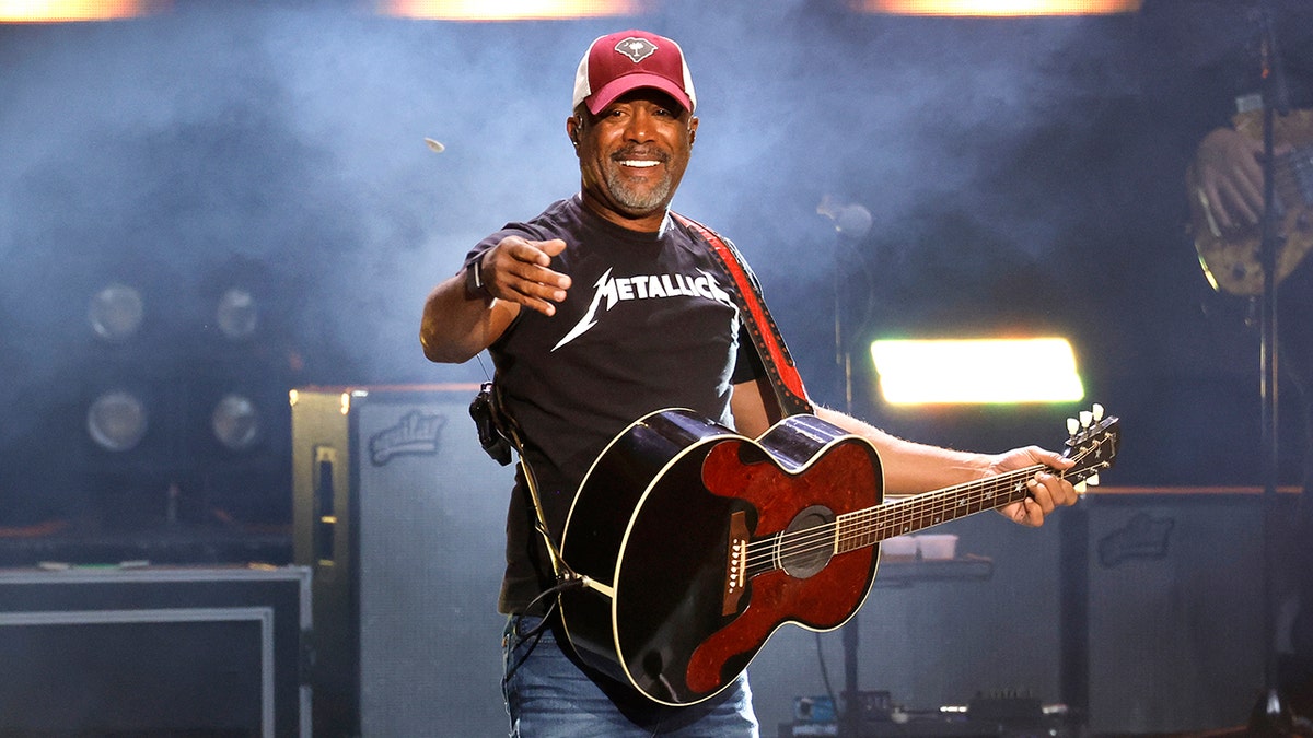 Darius Rucker on stage with a guitar