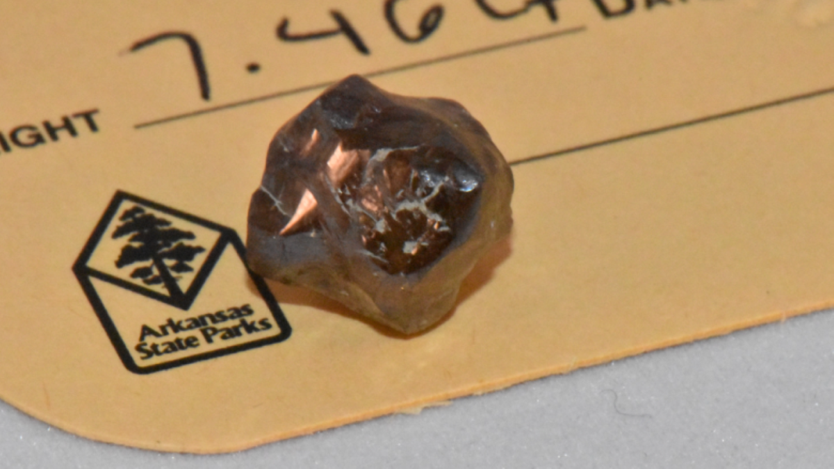 Detailed close-up of uncut brown diamond