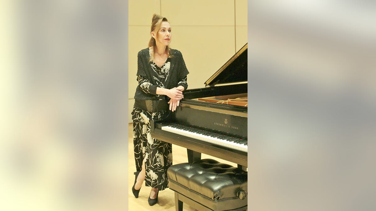 Dr. Catherine Godes at piano