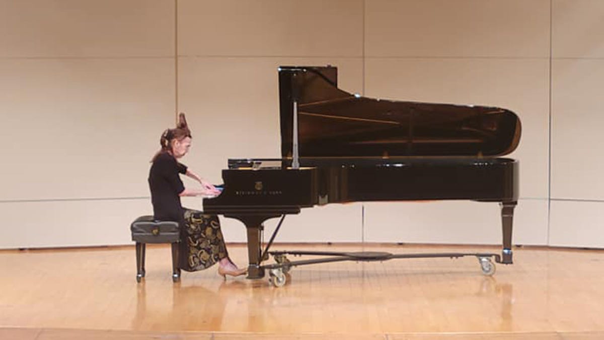 Dr. Catherine Godes playing piano