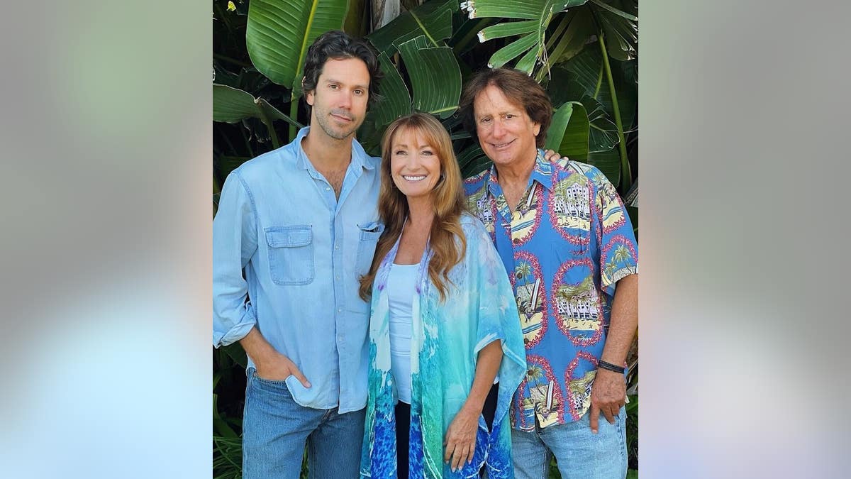 jane seymour with her boyfriend john zambetti and his son johnny against a tropical backdrop