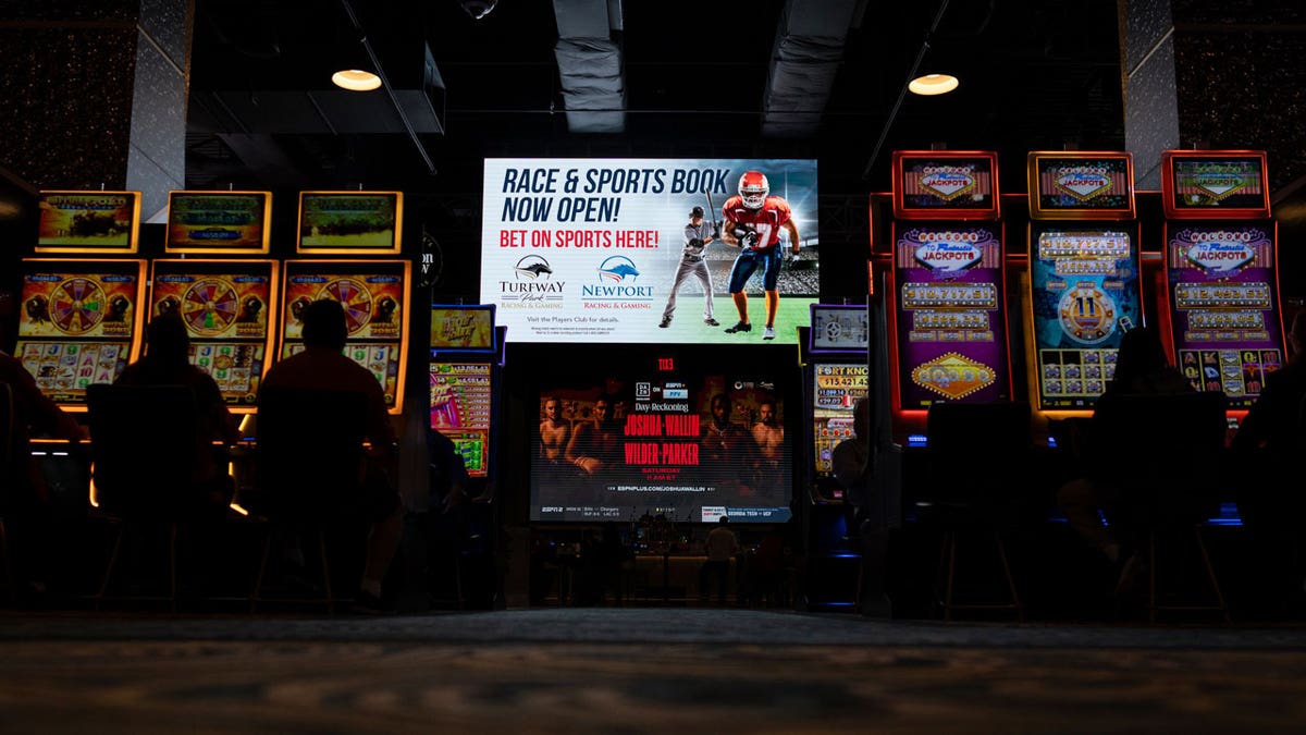 The large TV and betting machines in Churchill's Bourbon & Brew Bar & Grille at Turfway Park Racing & Gaming in Florence, Ky., make it easy to gamble. Legislators in Georgia discussed legalizing sports betting on Jan. 9, 2024.