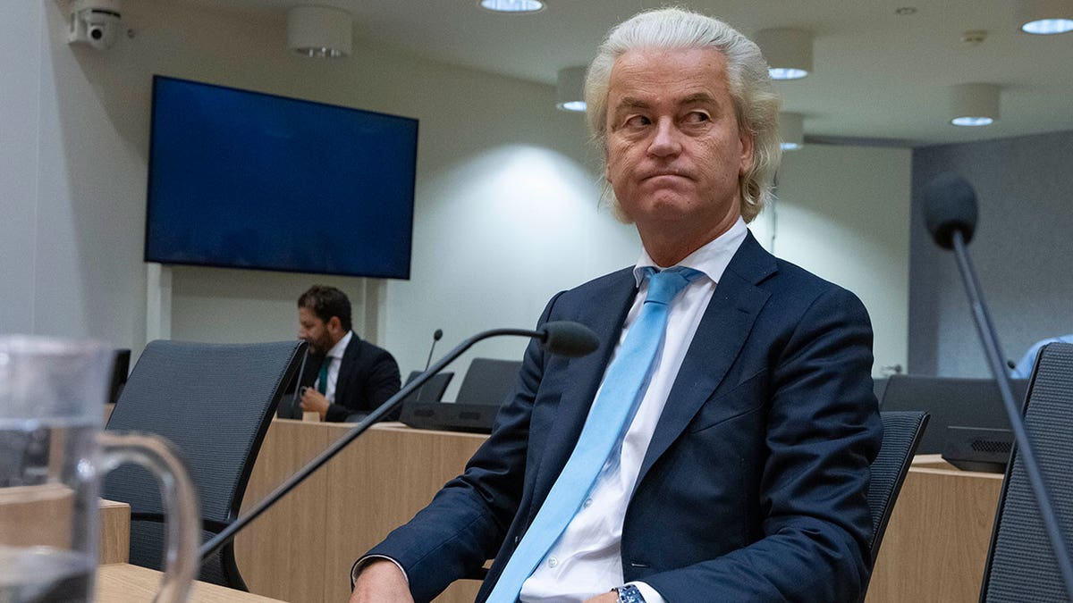 Geert Wilders listens in court