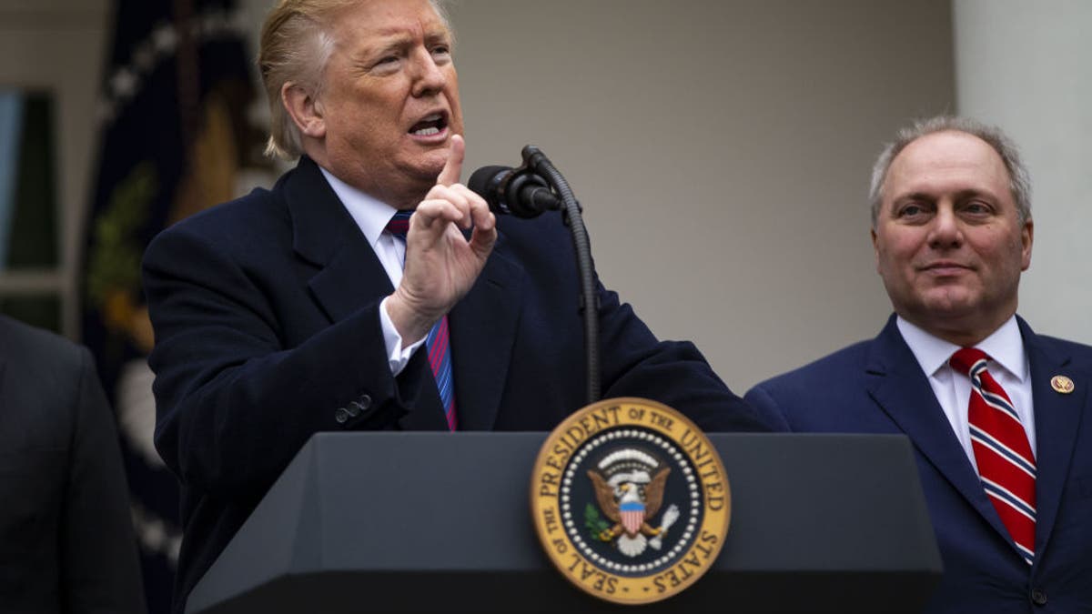 President Trump speaks while House Minority Whip Steve Scalise listens during a news conference in the Rose Garden of the White House on Jan. 4, 2019.