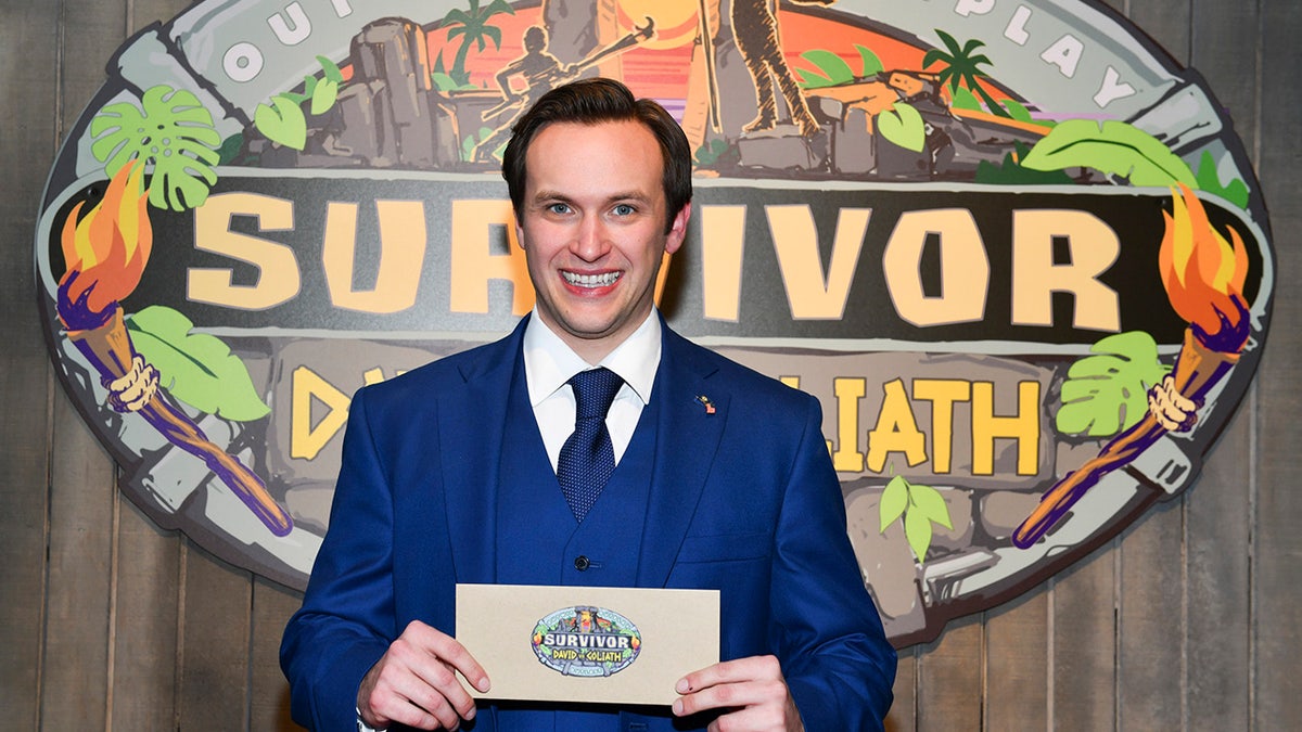 Wilson smiles after winning Survivor