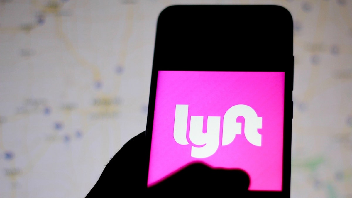 In this photo illustration the Lyft logo is seen displayed on a smartphone