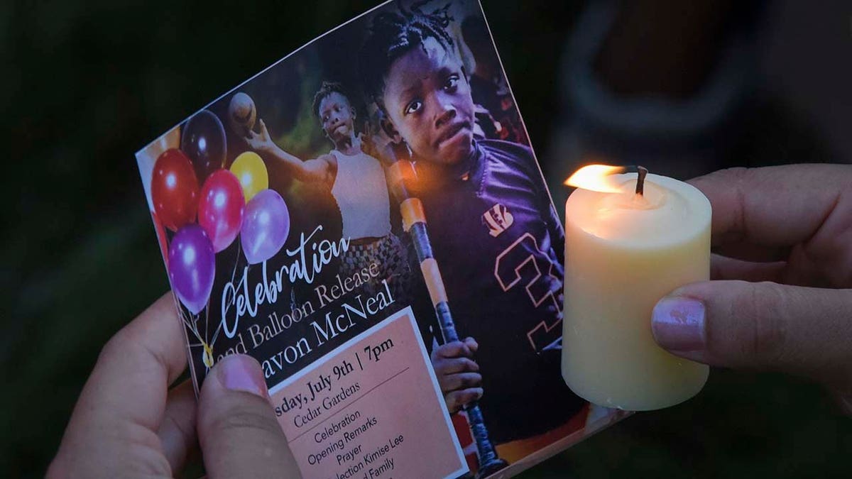 Candles are burned during a celebration of the life of 11-year-old sixth-grader Davon McNeal, who was fatally shot by a stray bullet after a July 4 anti-violence cookout organized by his mother in Washington, DC, Thursday, July 9, 2020. 