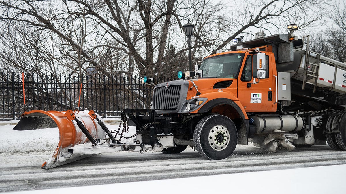 Snowplow removing snow