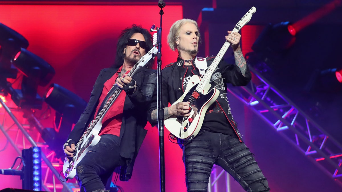 nikki sixx and john 5 on stage during 2023 tour