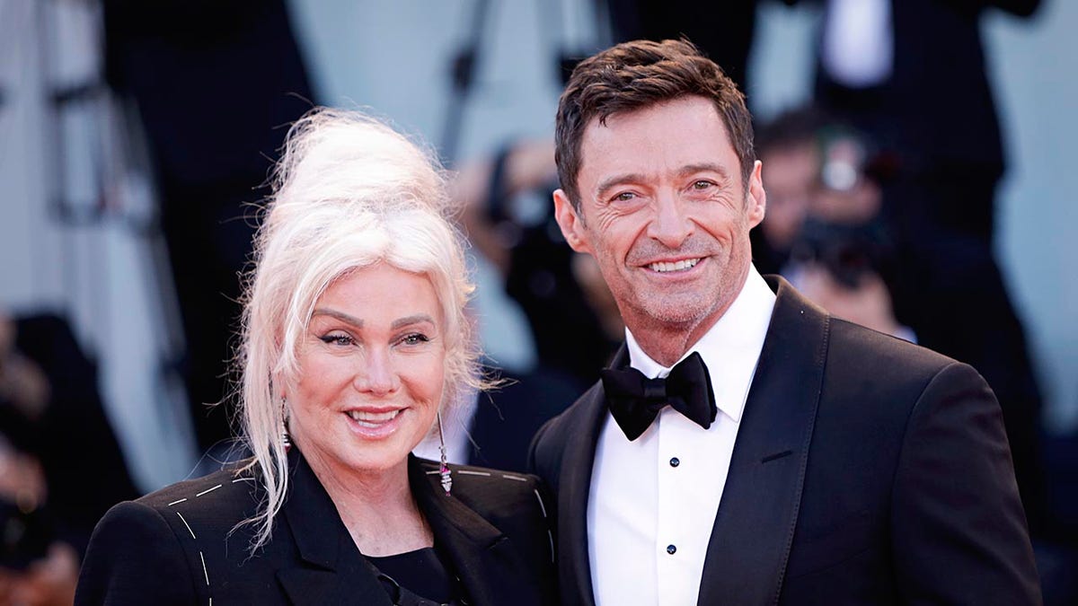 Hugh Jackman on red carpet with wife