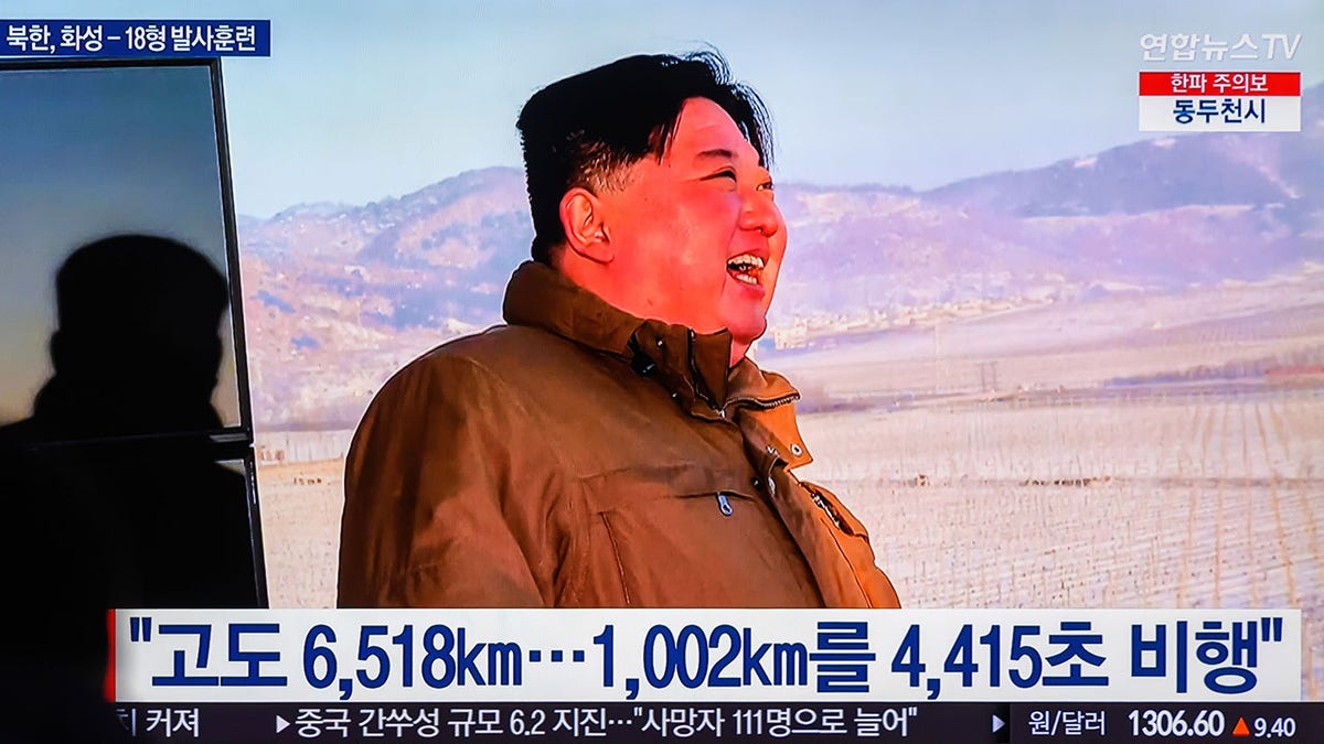 Kim Jong Un watching a rocket launch