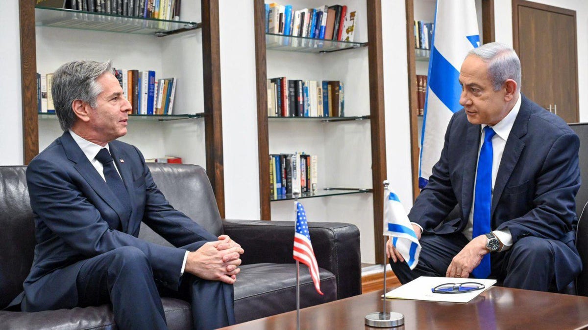 Antony Blinken on left, talking with Netanyahu