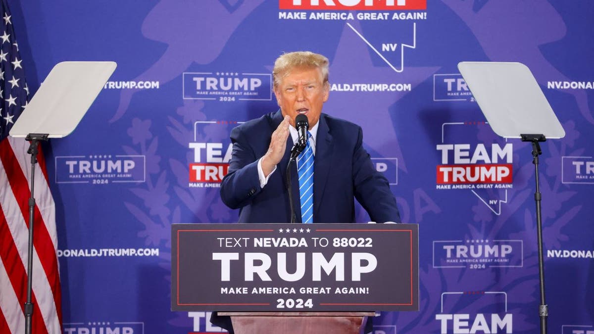 Wide shot of Trump speaking at event