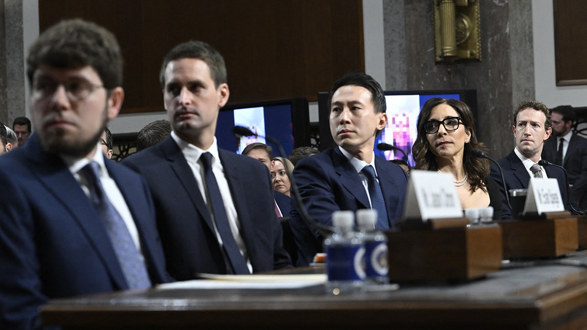 Jason Citron, CEO of Discord; Evan Spiegel, CEO of Snap; Shou Zi Chew, CEO of TikTok; Linda Yaccarino, CEO of X; and Mark Zuckerberg, CEO of Meta, watch a video of victims before testifying at the US Senate Judiciary Committee hearing, "Big Tech and the Online Child Sexual Exploitation Crisis," in Washington, DC, on January 31, 2024.?