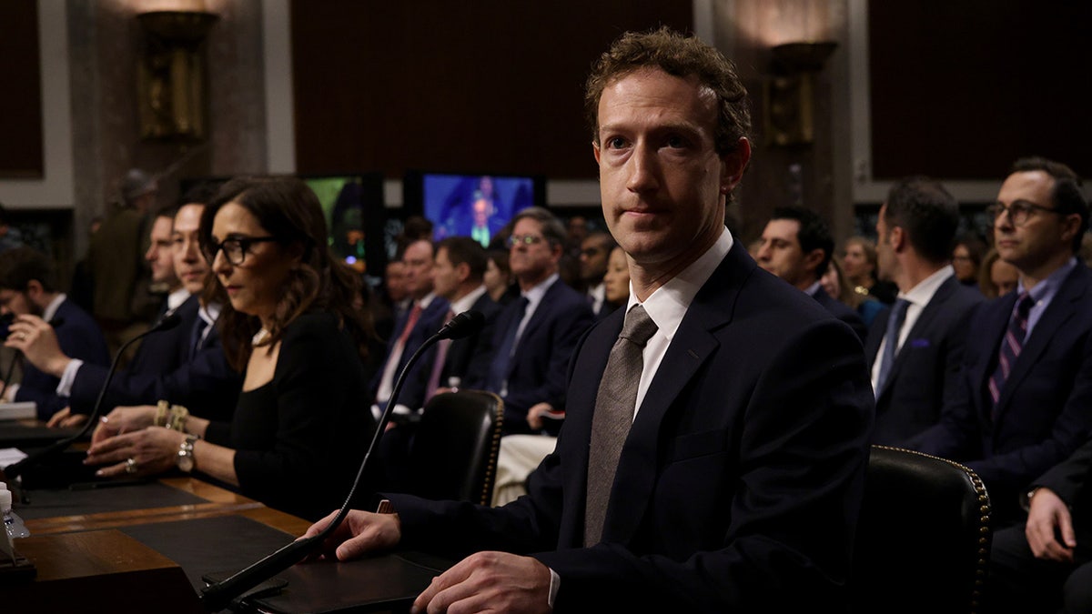 Mark Zuckerberg seated at table in congressional hearing