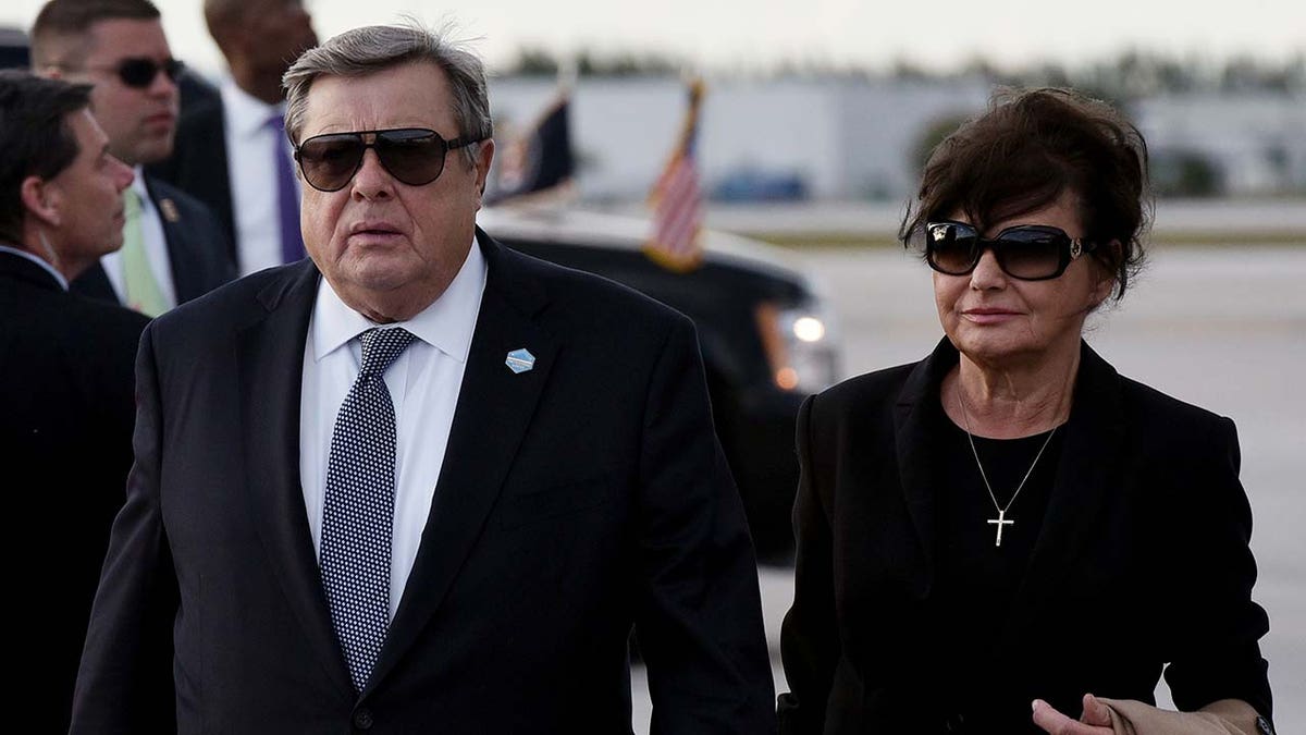 Viktor and the late Amalija Knavs, the parents of US First Lady Melania Trump, make their way to a vehicle upon arrival at Palm Beach International Airport in West Palm Beach, Florida on March 17, 2017.