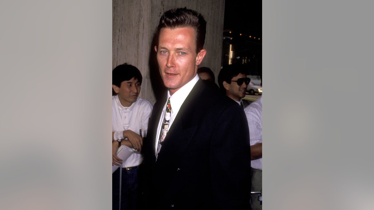 Robert Patrick posing on the red carpet in 1991
