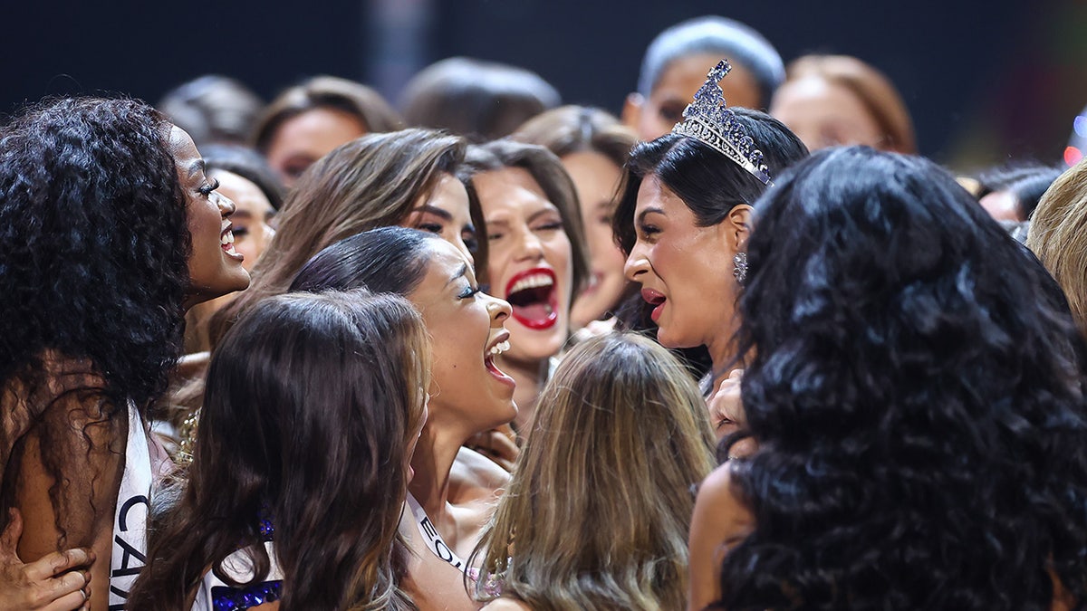 Groups of women crowding around Sheynnis Palacios after winning the crown