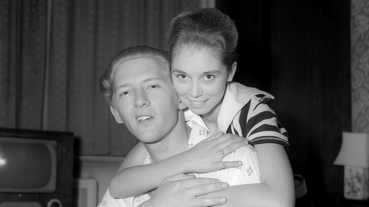 Jerry Lee Lewis being embraced by Myra Williams