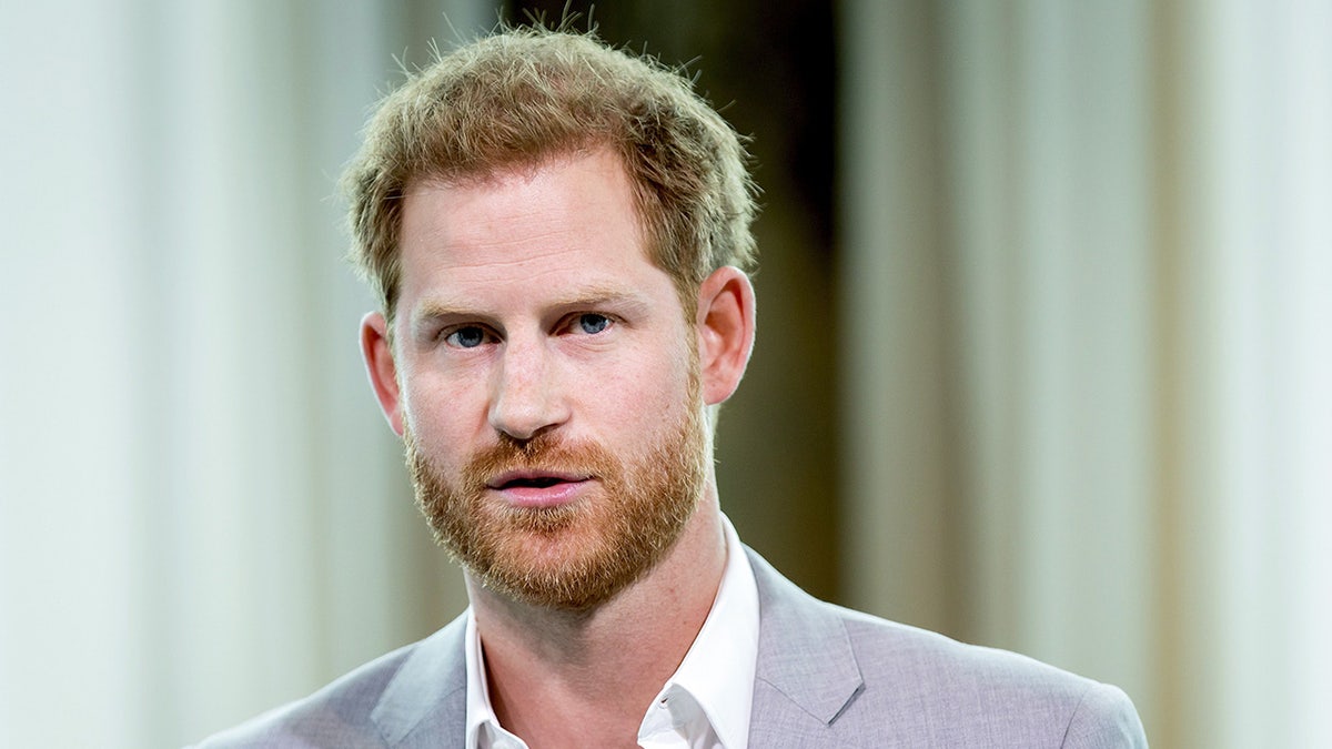 Close-up of Prince Harry wearing grey suit and a white shirt