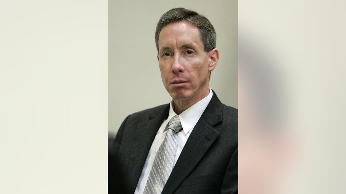 A close-up of Warren Jeffs in a suit and tie