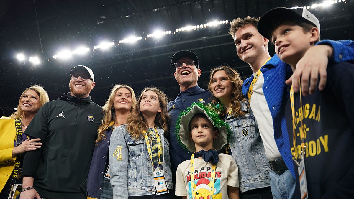  Jim Harbaugh celebrates with his family